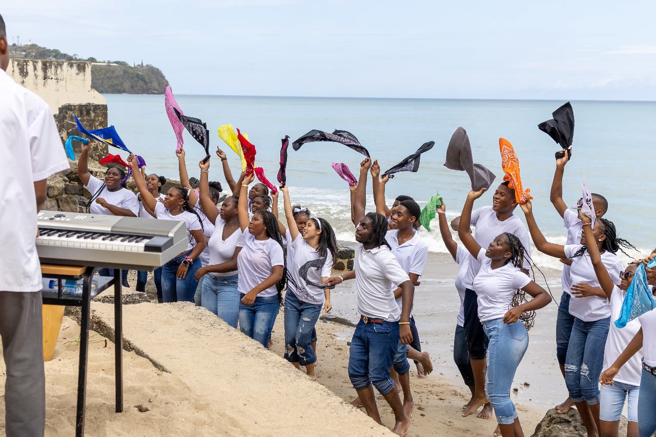Young people dancing and waving a bandana in the air