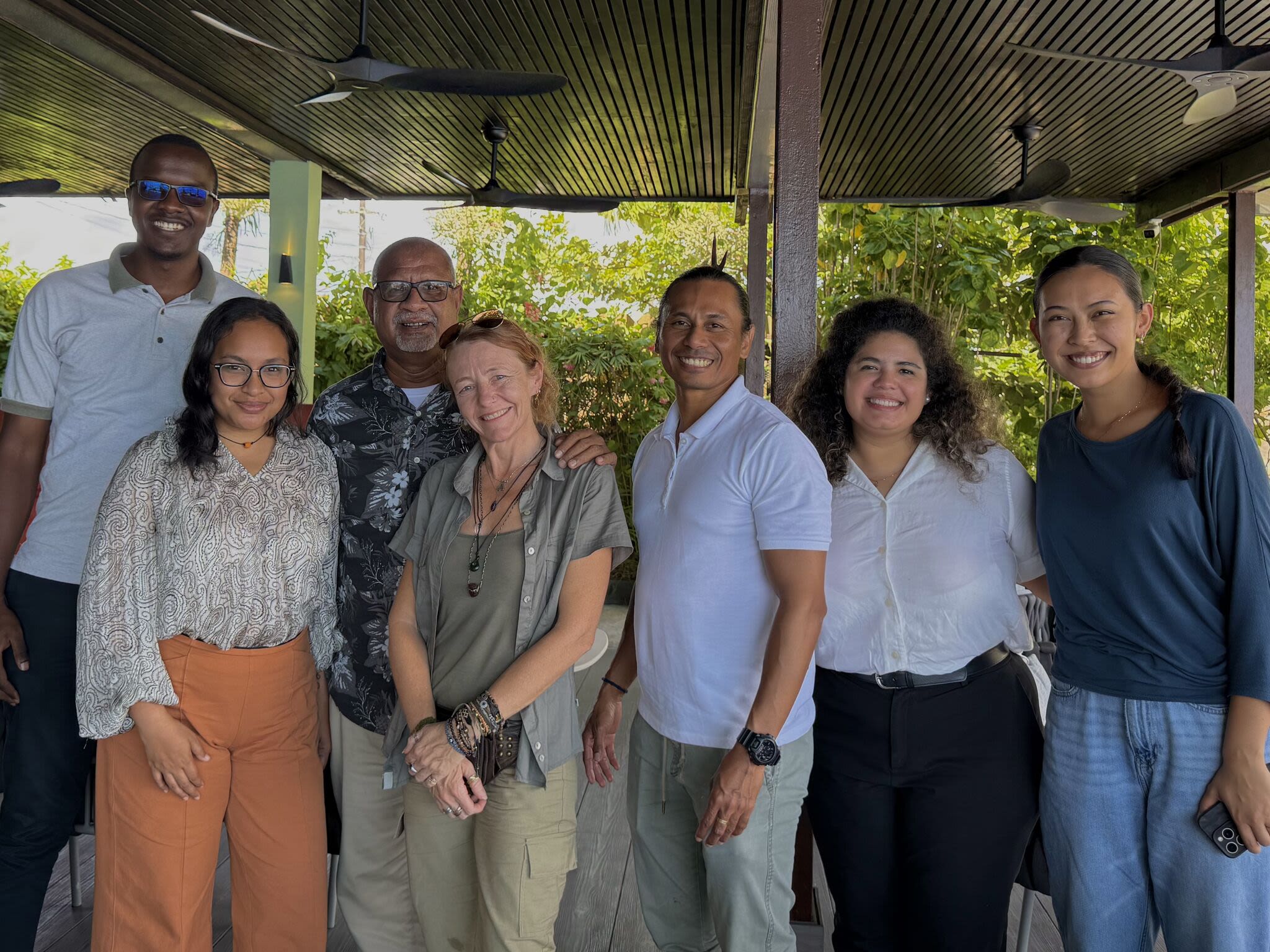 A group of six people posing for a photo. 